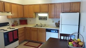 Iowa City apartment for rent - Seville Kitchen 1 Kitchen with electric range, dishwasher, and refrigerator at Seville Apartments in Iowa City, IA