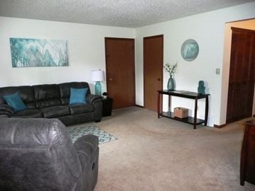 Coralville apartment for rent - a living room with couches and a table