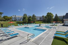 Farmington Hills apartment for rent - our apartments have a resort style pool with lounge chairs