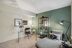 Farmington Hills apartment for rent - A bedroom with a bed, desk, and chair.