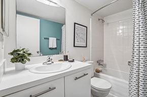Farmington Hills apartment for rent - A bathroom with a white sink and a white toilet.
