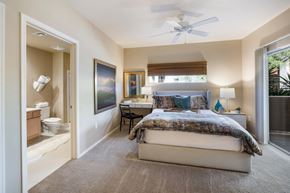 Tucson apartment for rent - a bedroom with a bed and a bathroom with a toilet and a sink