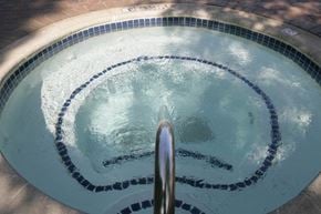 Farmington Hills apartment for rent - A round swimming pool with a metal drain in the middle.