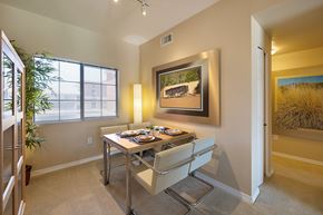Oro Valley apartment for rent - A dining room with a table set for two and a painting on the wall.