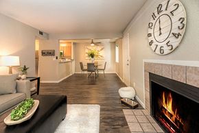Citrus Heights apartment for rent - Citrus Heights, CA Apartments for Rent-The Reva-Living Room with Vinyl Flooring, a Fireplace, Central Heating and Air, and a Ceiling Fan