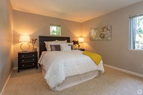 Citrus Heights apartment for rent - Apartments for Rent in Citrus Heights, CA - The Reva Apartments - Bedroom With Carpet Flooring, 2 Windows, and Stylish Decor