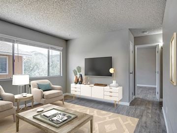 Sparks apartment for rent - an open living room with a television on the wall