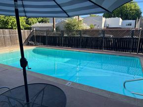 Sacramento apartment for rent - A pool with a fence around it.