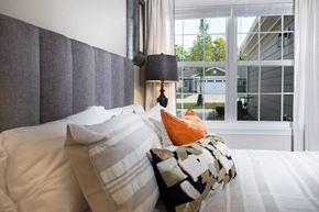 Louisville apartment for rent - a bedroom with a large bed and a window