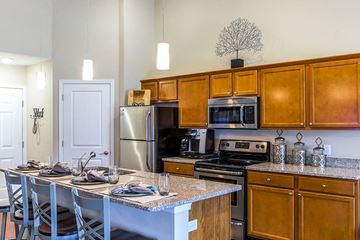 Louisville apartment for rent - a kitchen with stainless steel appliances and granite counter tops