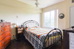 Palmetto apartment for rent - a bedroom with a bed and a dresser and a window