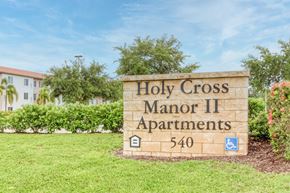 Palmetto apartment for rent - a sign apartments in front of a building