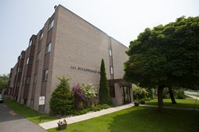 Kingston apartment for rent - a brick building on the side of a sidewalk