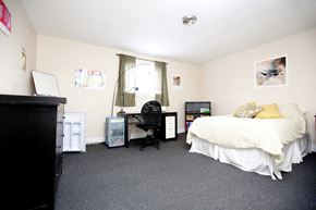 Kingston apartment for rent - a bedroom with a bed and a desk