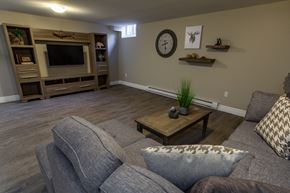 Kingston apartment for rent - A living room with a grey couch and a wooden coffee table.