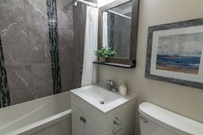 Amherstview apartment for rent - A bathroom with a white sink and a white bathtub.