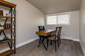 Amherstview apartment for rent - A room with a wooden table and chairs.