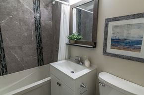 Amherstview apartment for rent - A bathroom with a white sink and a white bathtub.