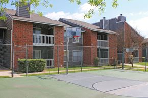San Antonio apartment for rent - a basketball court in front of an apartment building