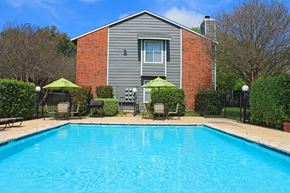 San Antonio apartment for rent - a swimming pool in front of a house with a pool