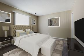 Omaha apartment for rent - a bedroom with a bed and a television