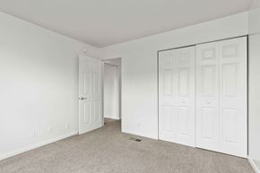 Fort Wayne apartment for rent - A white room with a carpeted floor and a white door.