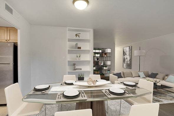 Denver apartment for rent - a living room and dining room with a table and chairs