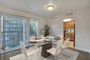 Denver apartment for rent - a dining room with a glass table and chairs