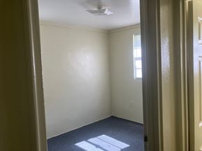 Beaufort Available Now apartment for rent - A room with a window and a ceiling fan.
