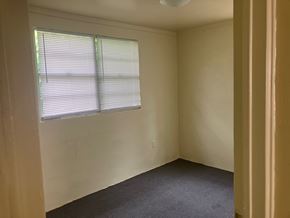 Beaufort Available Now apartment for rent - A room with a window and blinds.