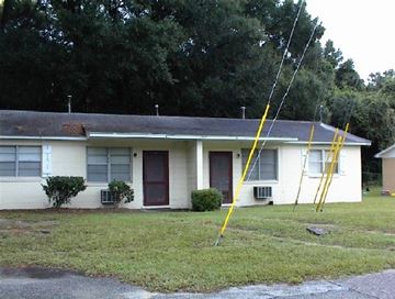 Beaufort - Coming Available 11/15/26 apartment for rent - a white house with a yellow ladder in front of it