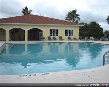 Oviedo apartment for rent - a large swimming pool with a building next to it