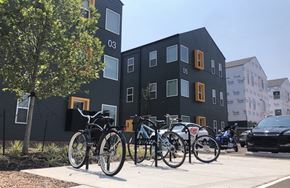 Oklahoma City apartment for rent - a row of bikes parked in front of a building