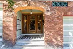 San Francisco apartment for rent - A brown door is framed by a brick archway.