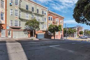 San Francisco apartment for rent - A street view of a residential area with buildings and a clear sky.