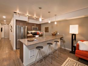 Seattle apartment for rent - Kitchen island and living area at Infinity Apartments in Seattle WA