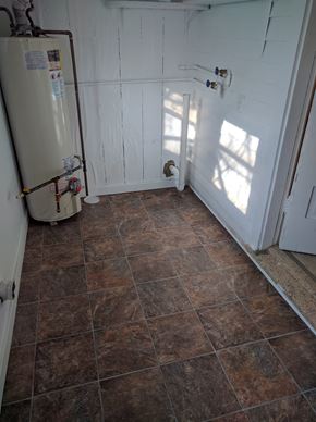 Cheyenne apartment for rent - a bathroom with a refrigerator and a tiled floor