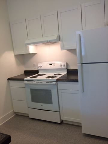 Beaufort - Coming Available 9/30/26 apartment for rent - A white stove and oven in a kitchen.