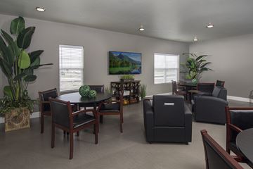 Marysville apartment for rent - A living room with a painting of a landscape on the wall.