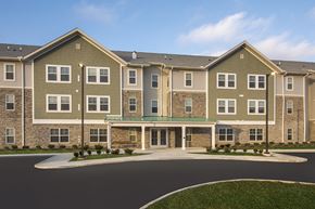 Marysville apartment for rent - A large apartment complex with a green lawn in front.
