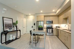 Pasadena apartment for rent - A modern kitchen with a dining table and chairs.