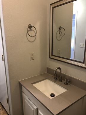 Decatur apartment for rent - A bathroom with a sink and a mirror.