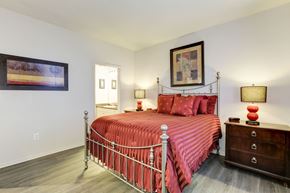 College Park apartment for rent - a bedroom with a bed and a dresser