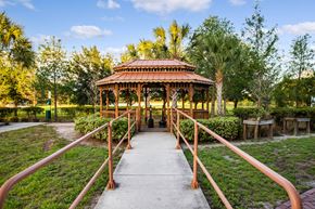 Fort Myers apartment for rent - walkway with railings to gazebo in courtyard