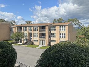 Scranton apartment for rent - a large brick apartment building with a street in front of it