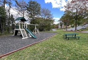 Scranton apartment for rent - a playground with a slide and a picnic table