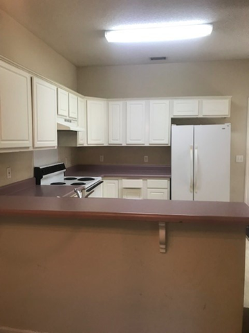 Port Royal - Coming Available 9/5/26 apartment for rent - an empty kitchen with white cabinets and a counter top