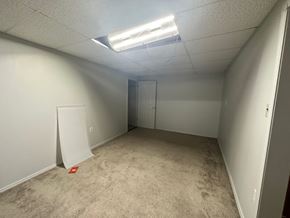 Pea Ridge apartment for rent - A room with a carpeted floor and a white door.