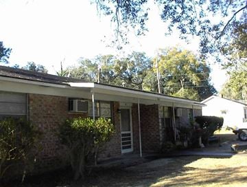 Beaufort -  Coming Available 11/5/26 apartment for rent - the front of a brick house with a car in the driveway