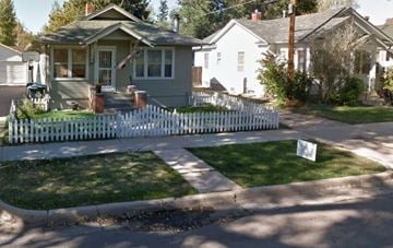Cheyenne apartment for rent - A white picket fence surrounds a house.